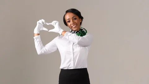 Black stewardess on gray background Stock Footage 97984374