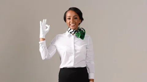 Black stewardess on gray background Stock-Footage 97984523