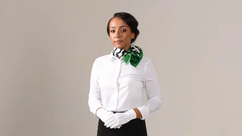 Black stewardess on gray background 스톡 동영상 97985588