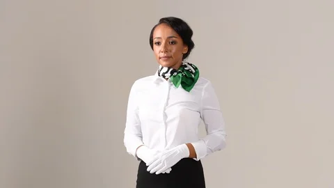 Black stewardess on gray background Stock Footage 97985784