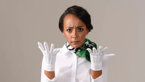 Black stewardess on gray background Stock Footage 97986088