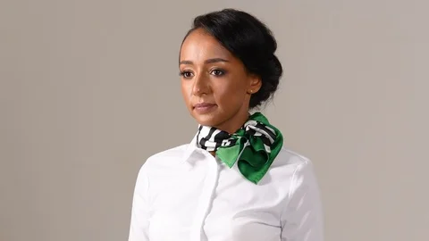 Black stewardess on gray background 스톡 동영상 97986693