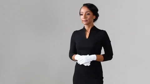 Black stewardess on gray background 스톡 동영상 98211904