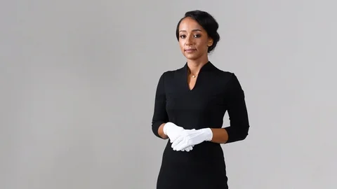 Black stewardess on gray background 스톡 동영상 98212151