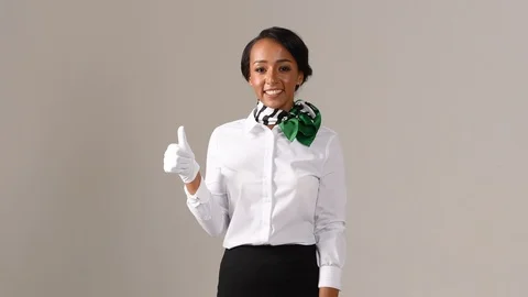 Black stewardess on gray background 스톡 동영상 98212428