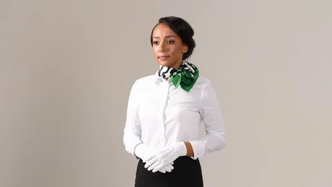 Black stewardess on gray background 스톡 동영상 98214351