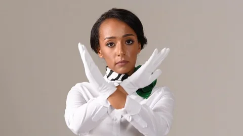 Black stewardess on gray background 스톡 동영상 98214699