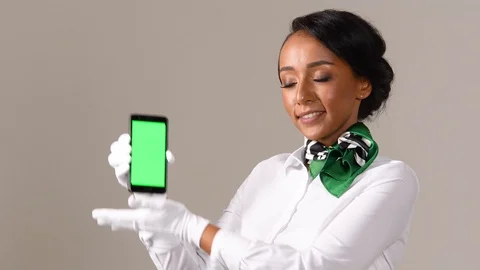 Black stewardess on gray background Stock Footage 98215963