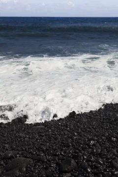 Black stone beach Stock Photos