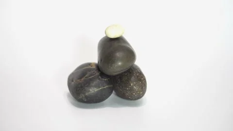 Black stone stack zooming studio shot Stock Footage 184908023