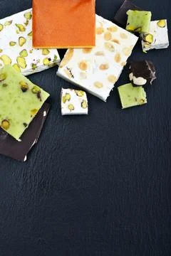Black stone tray with different turron Stock Photos