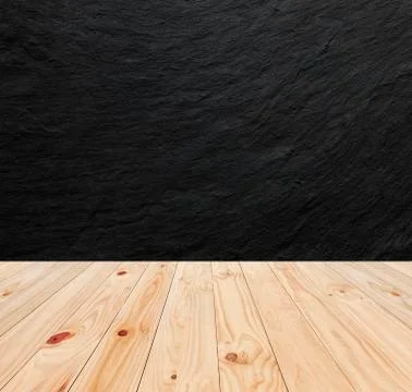 Black stone wall background and wood table Stock Photos