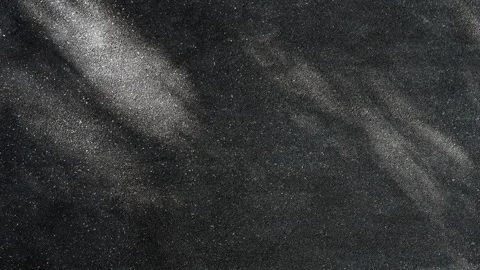 Black stone wall texture with shimmering sunlight and moving tree shadows. Stock Footage 330149649
