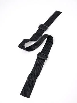 Black strap lies in a zigzag pattern on a white background Stock Photos