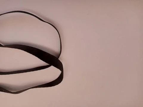 Black Strap on Minimalist Light Background Stock Photos