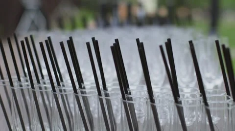 Black straws in glasses Stock Footage 55904807