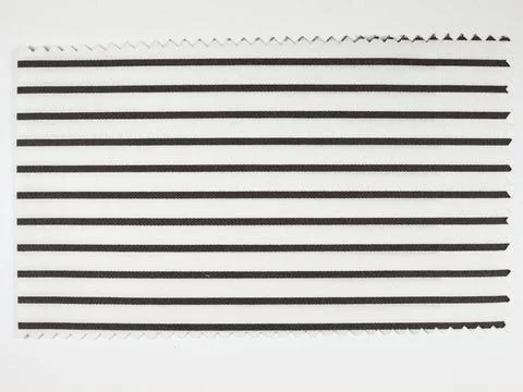 Black Striped fabric sample Black striped fabric sample swatch with zigzag... Stock Photos
