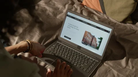 Black Student Browsing University Website on Laptop at Home Stock Footage 338103117
