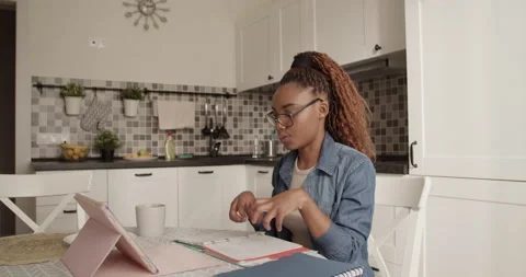 Black student discussing assignment with online teacher Stock Footage 200929840