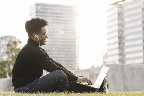Black student making a video call with computer 스톡 사진