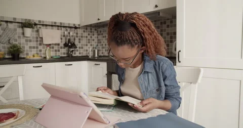 Black student starting to read textbook Stock Footage 200930147