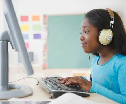 Black student using computer in classroom 写真素材