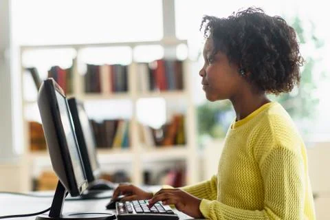 Black student using computer in classroom 写真素材