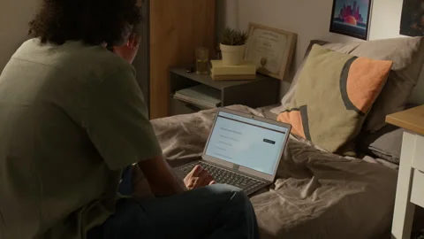 Black Student Using Laptop to Research University Programs Online Stock Footage 338091246