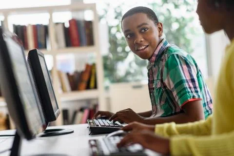 Black students using computers in classroom 스톡 사진