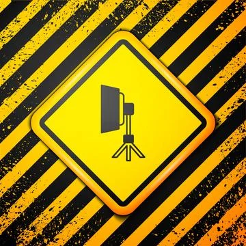 Black Studio light bulb in softbox icon isolated on yellow background. Shadow Illustrazione stock