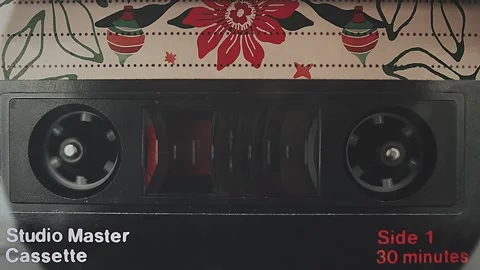 Black Studio Master Cassette Tape with Red and Green Christmas Ornaments Vi.. Stock Footage 311793673