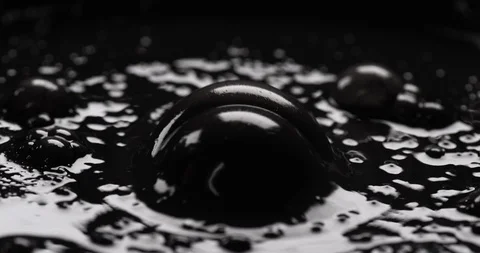 Black substance bubbling on surface with highlights Stock Footage 104159418