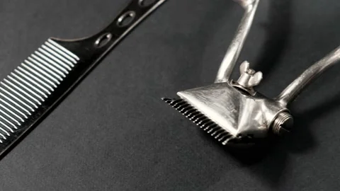 On a black surface are old barber tools. Vintage Stock Footage 143175742