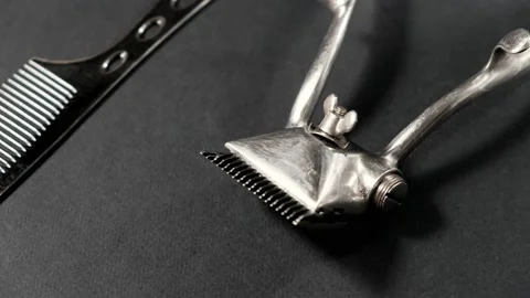 On a black surface are old barber tools. Vintage Video stock 143175787