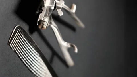 On a black surface are old barber tools. Vintage manual Stock Footage 143176014