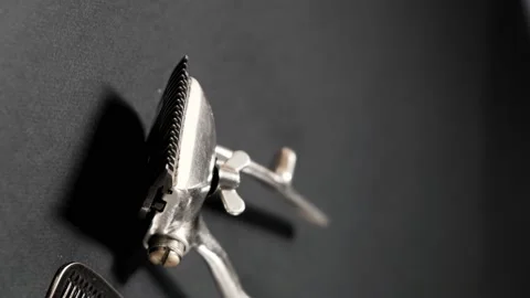 On a black surface are old barber tools. Vintage manual 動画素材 143176580