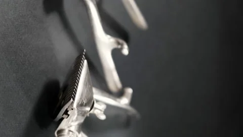 On a black surface are old barber tools. Vintage manual Stock Footage 143176677