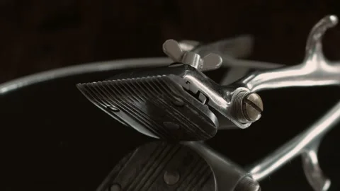 On a black surface are old barber tools. vintage manual hair clipper. black mono Video stock 156297455