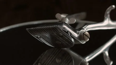 On a black surface are old barber tools. vintage manual hair clipper. Video stock 156297542