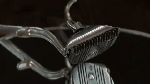 On a black surface are old barber tools. vintage manual hair clipper. Stock Footage 156297736