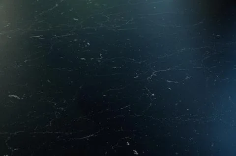 A black surface with a few small white spots Stock Photos