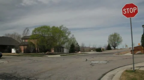 Black SUV drives past a stop sign.mp4 Stock Footage 10922923