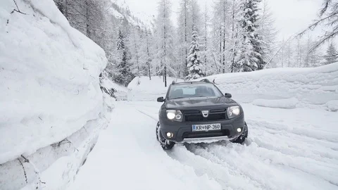 A black suv stuck in alpine snow Stock Footage 103223341