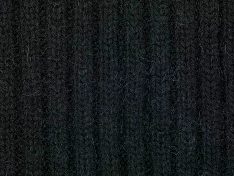 Black sweeter fabric, close up Stock Photos