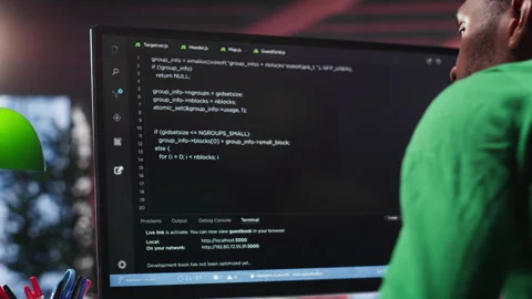 Black system administrator creating a software with programming language Stock Footage 307723443