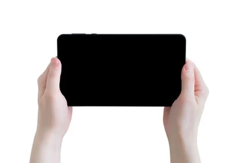 Black tablet with a black display in the hands of a Caucasian girl. Close-up. Stock Photos