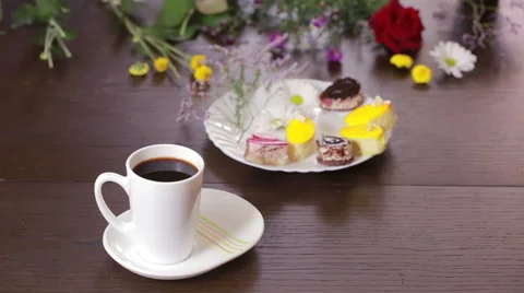 Black tea and coffee in mugs. table with a drink and dessert. view from above Stock Footage 67811712