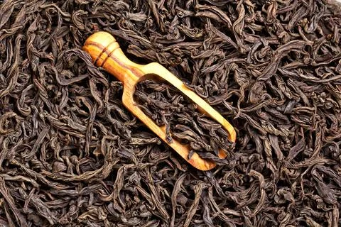 Black tea background loose leaf tea with a scoop Stock Photos