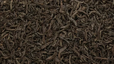 Black tea - background. The tea leaves are dried, top view. Stock Footage 143191045