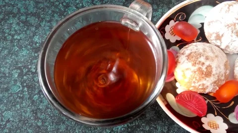 Black tea in a cup and candy Stock Footage 72853244